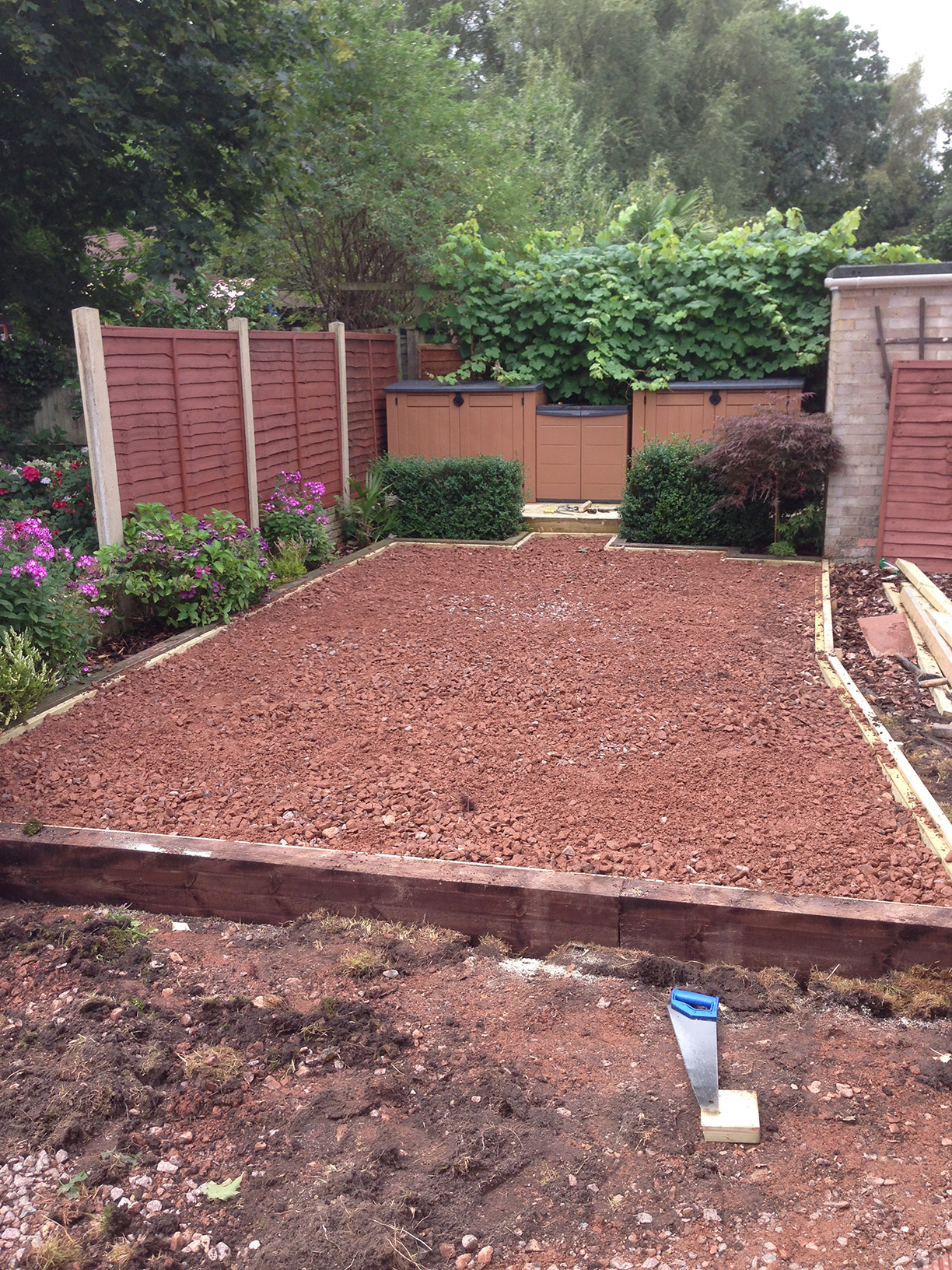 Bark play area adjacent to artificial lawn
