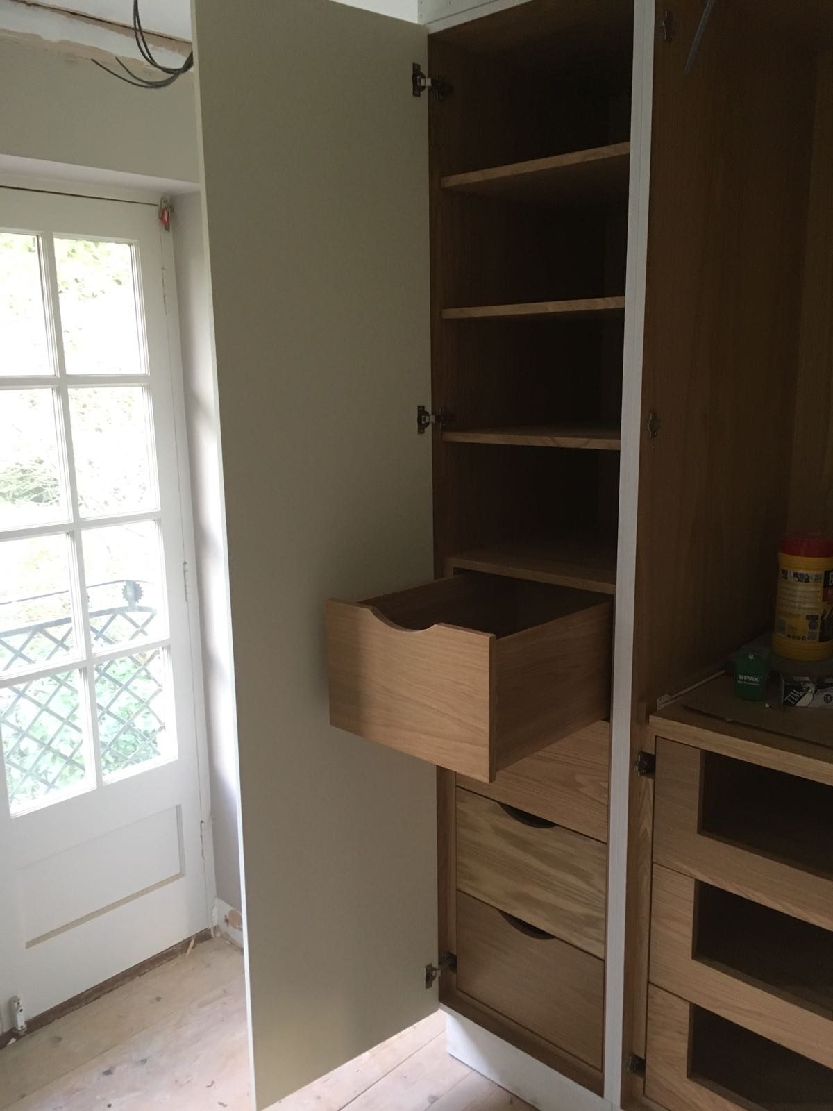 Primed shaker doors fitted to oak veneer wardrobes